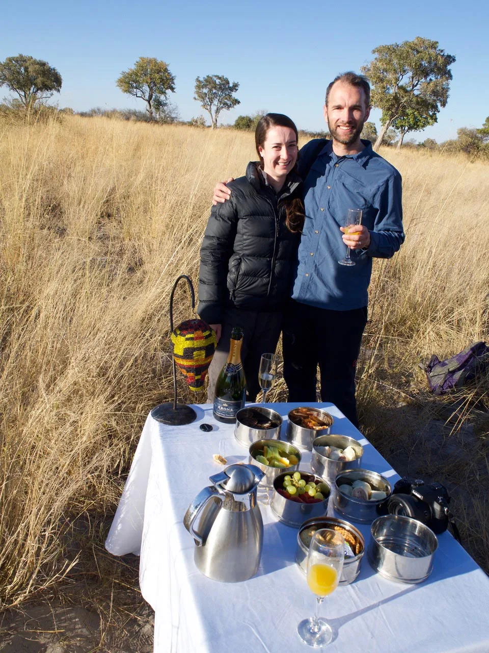 Charlotte & Dan enjoying a game drive morning tea break during their honeymoon safari.