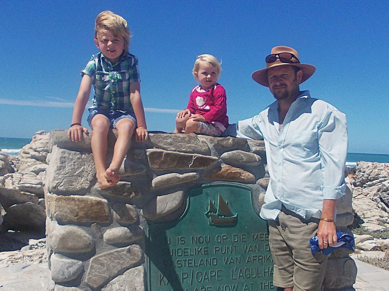 Crusty with Henry and Olive at the Cape Agulhas beacon.